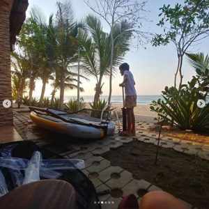 Kid assembling an inflatable sailboat tiwal 3 in Angola