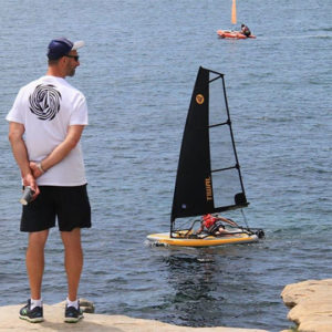 Man looking at Tiwal 3 inflatable sailboat in New Zealand