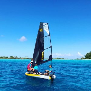 kids on tiwal inflatable sailboat