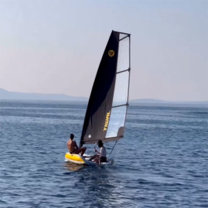 Duo sailing on a Tiwal 2L family sailing dinghy