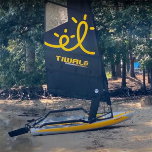 Tiwal sailing dinghy on a sand beach